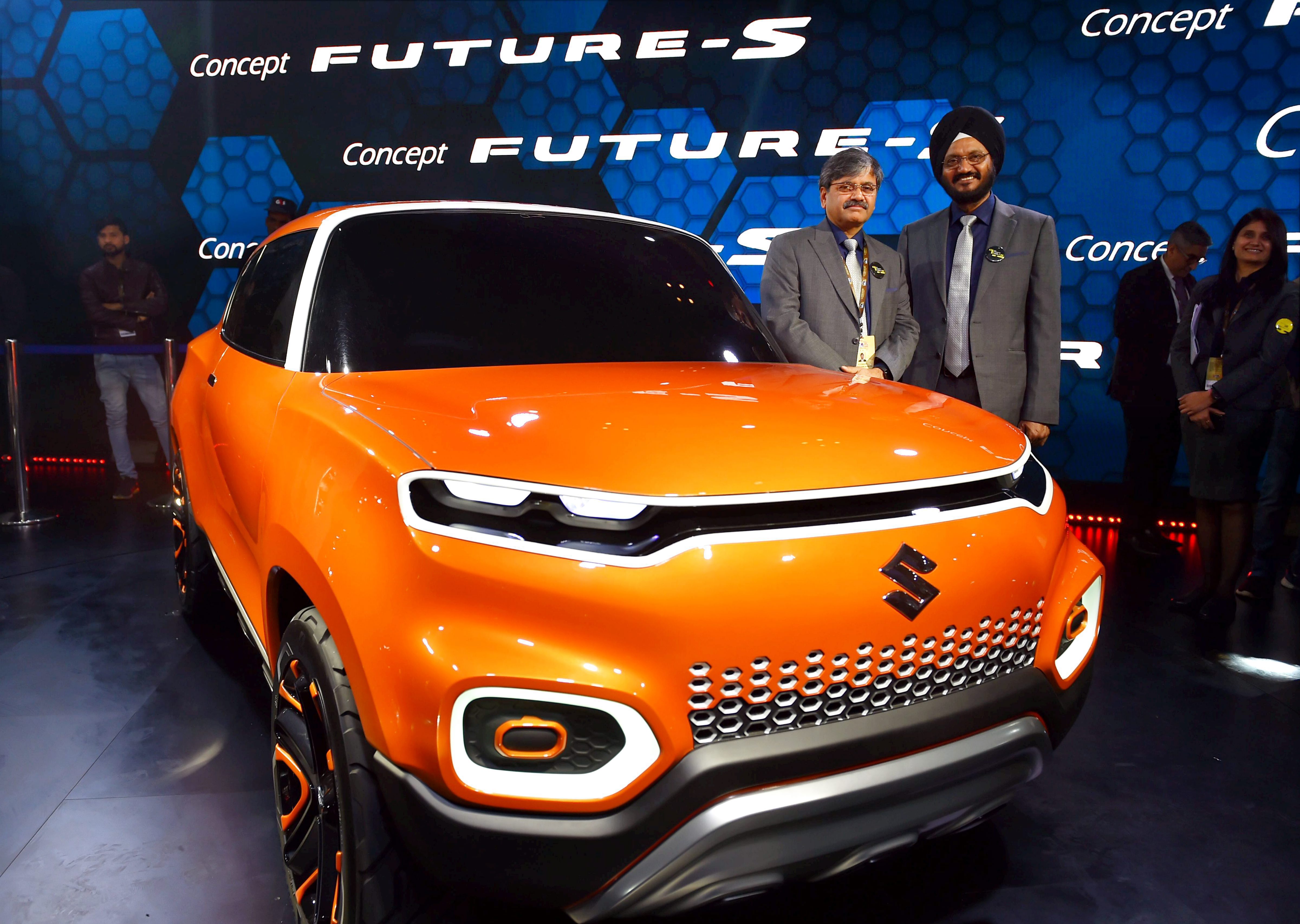 Maruti Suzuki's Senior Executive Director, Marketing and Sales RS Kalsi (R) and Senior Executive Director (Engineering) CV Raman showcase the company's ConceptFutureS at the Auto Expo 2018