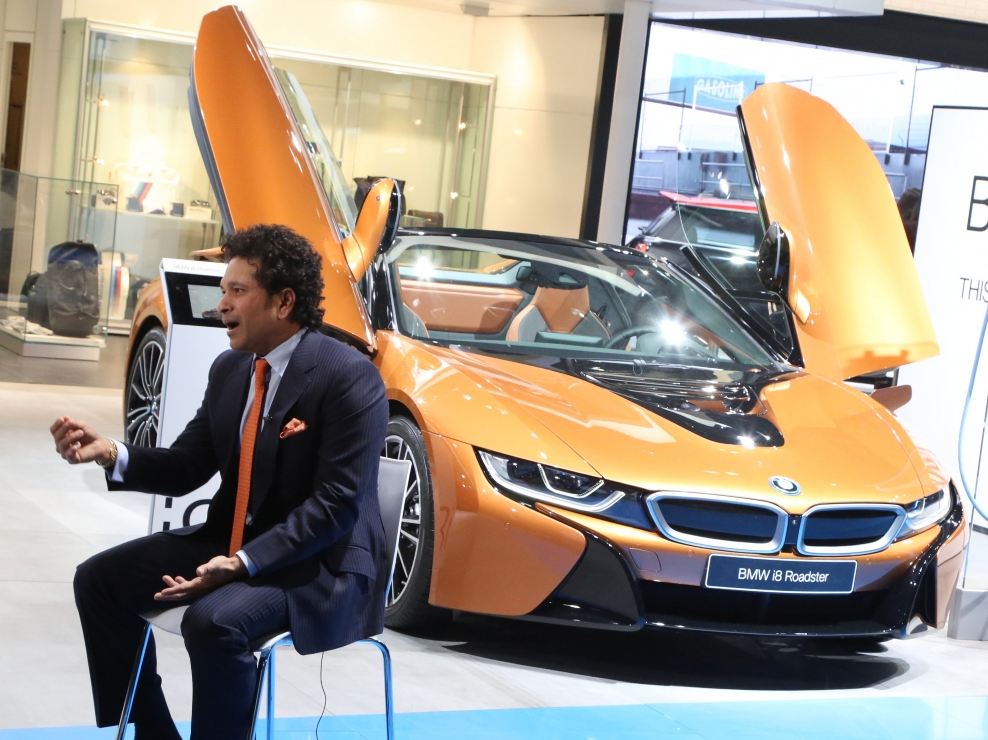 A view of the BMW i8 Roadster seen behind Cricket legend Sachin Tendulkar