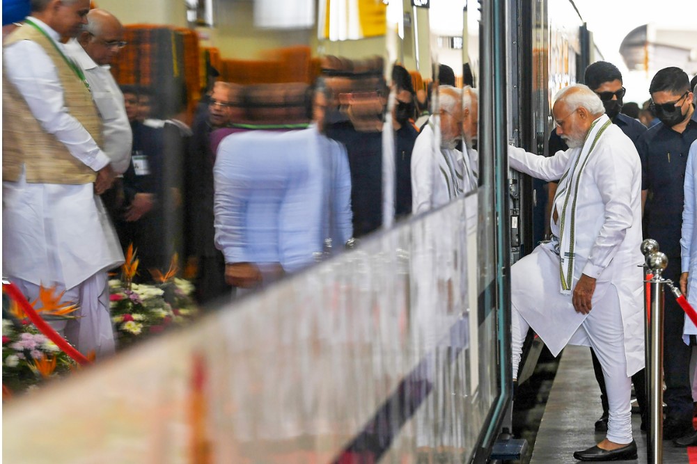 PM Modi boards the Gandhinagar-Mumbai Vande Bharat Express train during its flagging off ceremony, in Gandhinagar.