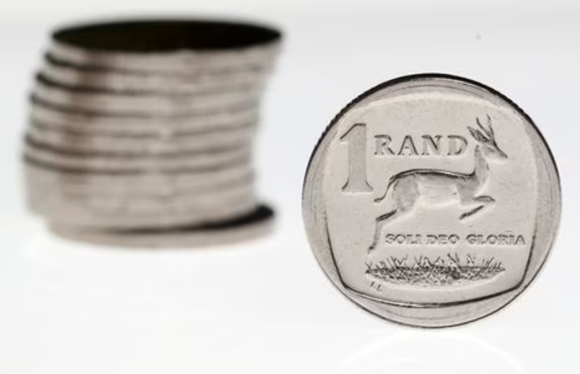 South African rand slightly stronger against muted dollar