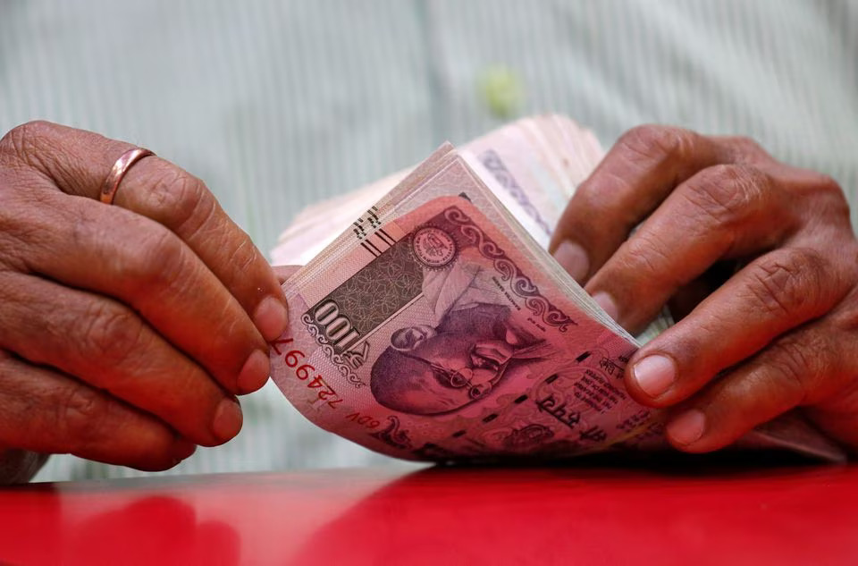 Rupee trades in narrow range against US dollar