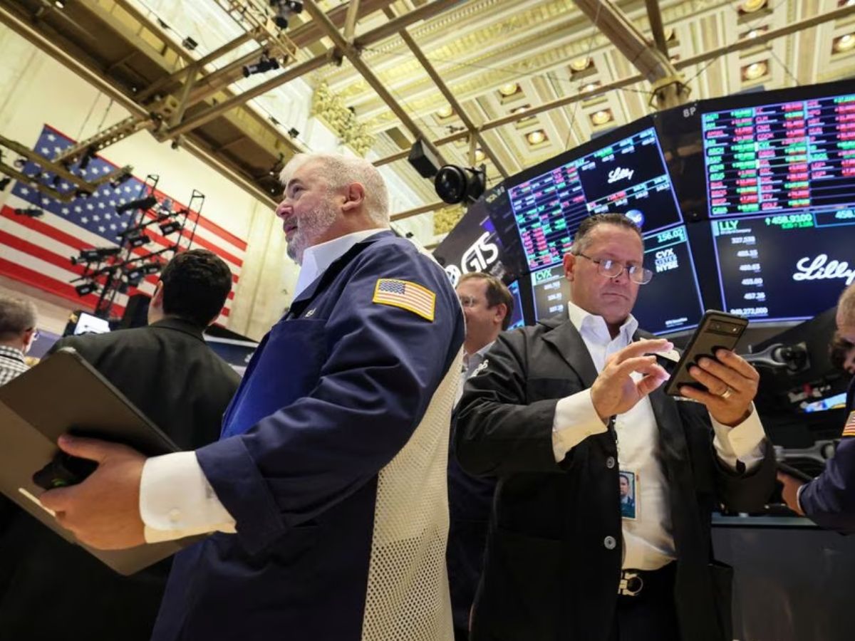 Wall Street closes higher on eve of Fed decision; investors assess earnings