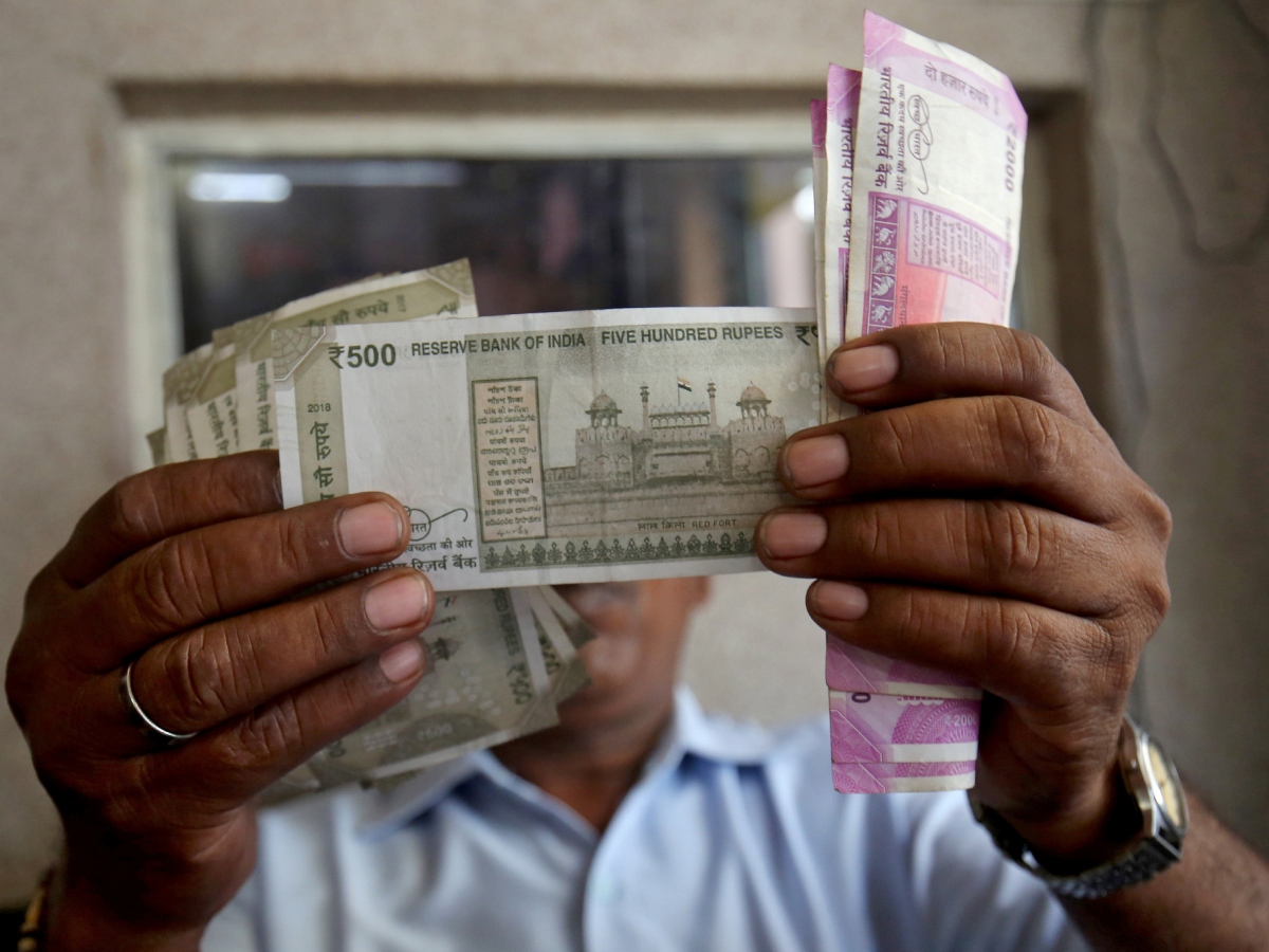 Rupee gains by 7 paise to end at 83.30 against US dollar