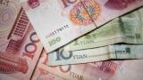 China weakens yuan-dollar rate below 6.9 mark