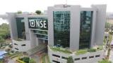 Sensex hits record; auto stocks rise