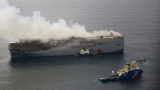 Burning car carrier off Dutch coast being towed away from shipping lanes