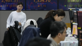 Global markets edge lower as China reports slower growth in the last quarter