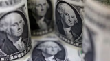 Dollar down as markets bet Fed done with hikes